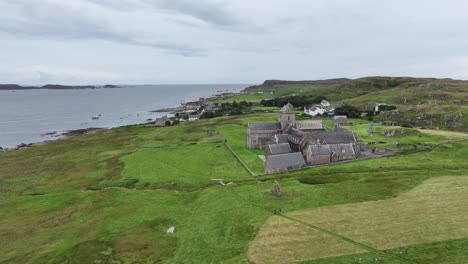 Drone-Shot-of-Iona-Island,-Scotland-UK,-Abbey-and-Nunnery-Building-in-Green-Landscape