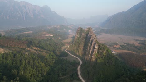 Road-leading-through-the-mountains-in-Vang-Vieng,-the-adventure-capital-of-Laos