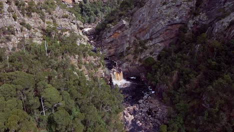 Drone-view-of-waterfall-in-Leven-Canyon-in-Tasmania,-Australia-during-daytime