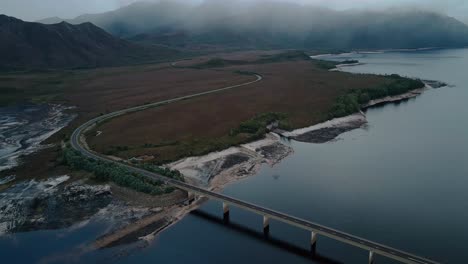 Top-angle-shot-of-Lake-Burbury-and-landscape-of-Tasmania,-Australia-during-foggy-morning