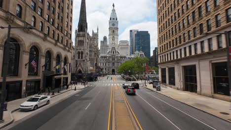 FPV-drone-flight-above-N-Broad-Street-past-Pennsylvania-Convention-Center-towards-City-Hall-and-William-Penn-Statue