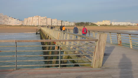 Pan-shot-on-wooden-pier-in-Saint-Jean-de-Monts,-France