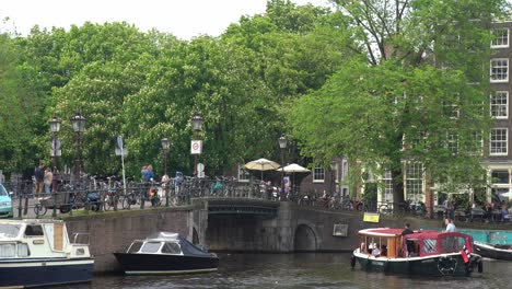 Tourist-boat-cruising-in-canal