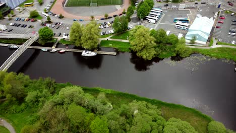 Aerial-footage-travelling-overhead-of-river-leading-into-Lough-Erne-in-Enniskillen,-Northern-Ireland