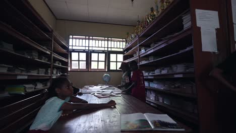 School-library-in-Papua-Indonesia-with-gymnasium-age-teenage-children