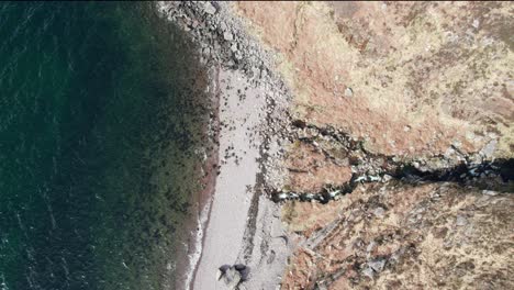An-aerial-shot-of-a-rocky-beach-in-Scotland