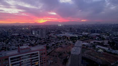 Aerial-shot-of-a-dramatic-dusk-sky-above-the-Metropolis-of-Santiago-de-Chile