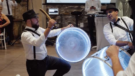 Slow-motion-shot-of-a-drumming-group-performing-at-a-wedding-ceremony