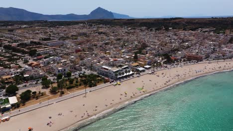Beautiful-Aerial-View-Above-San-Vito-Lo-Capo-Beach-Town-in-Sicily,-Italy