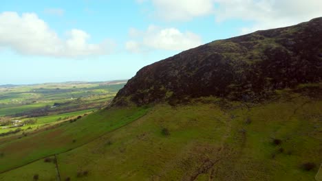 Aerial-shot-of-Slemish-Mountain,-situated-in-Broughshane,-County-Antrim-in-Northern-Ireland