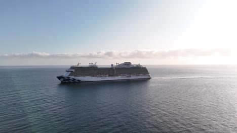 Cruise-ship-sailing-near-Catalina-Island,-California-during-a-sunny-day,-aerial-view