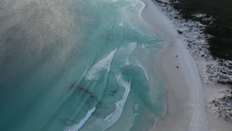 Vehicles-driving-along-Wharton-Beach,-Western-Australia