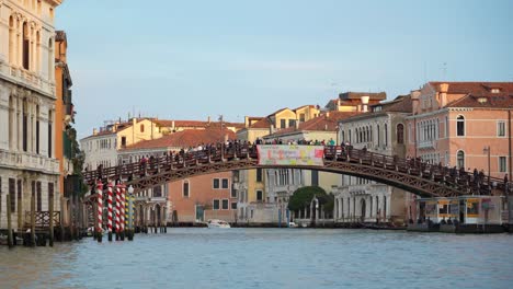 People-Walk-on-a-Wooden-Bridge-That-is-Built-in-Venice-Grand-Canal