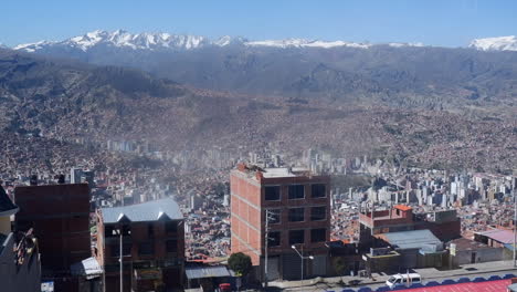 Dolly-shot-through-window-of-Teleferico-cable-car-over-La-Paz,-Bolivia