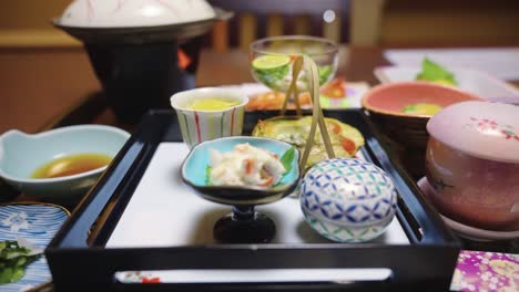 Pan-across-Kaiseki-meal-in-Traditional-Ryokan-Inn,-Japanese-Cuisine