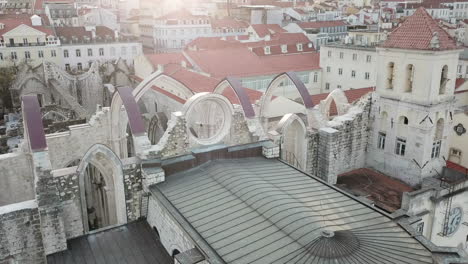 Lisbon,-Drone-Footage-starting-from-the-collapsed-roof-top-of-Carmo-Monastery-and-sliding-towards-to-Rossio-Sqaure