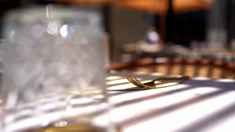 Front-view-of-stylish-and-light-dining-table-in-restaurant-close-up-shot
