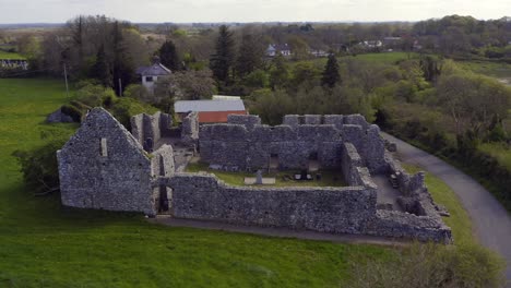 Aerial-orbit-of-Annaghdown-Abbey-on-a-sunny-day