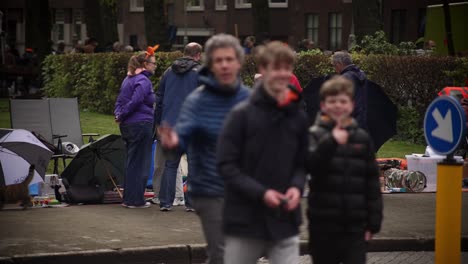 Netherlands-Koningsdag-Kingsday-King's-day-Amsterdam-street-scene-with-people