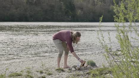 The-man-prepares-the-bonfire-and-set-the-positioning-with-a-stick