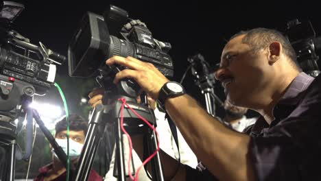 Video-journalist-setting-up-his-camera-during-Lok-Sabka-Election-campaign-2024