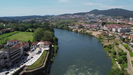 Aerial-view-of-Barcelos,-Portugal-with-a-bridge-over-Cavado-River