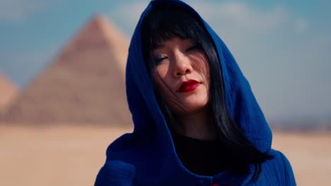 Closeup-shot-of-elegant-woman-in-Egypt-with-pyramids-in-background