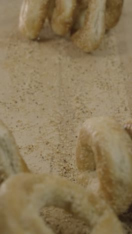 Sliding-bagels-on-a-cutting-board-in-slow-motion