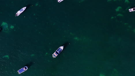 Topdown-aerial-view-of-a-boat-parking-area-in-the-ocean