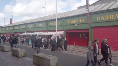 People-walk-past-the-famous-Barras-signage
