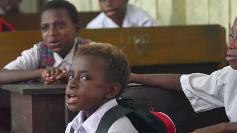 Mixed-Papuan-children-singing-in-classroom-village-school-Indonesia