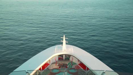 Bow-of-the-Sailing-Cruise-ship-on-the-ocean-with-sunset-evening