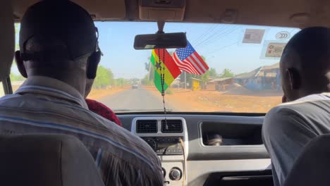 driving-with-tour-guide-on-remote-rural-road-to-Wulugu-village,-in-Northern-Ghana