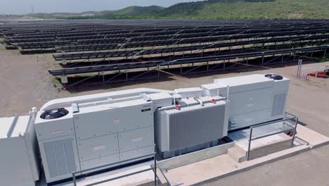 Power-Plant-Generator-in-front-of-solar-panels-farm-park-on-tropical-island-during-sunny-day