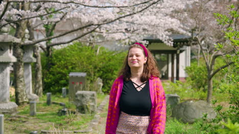 Female-Tourist-Enjoying-Sakura-Scenery-At-Tsubosaka-dera-Temple-In-Takatori,-Japan