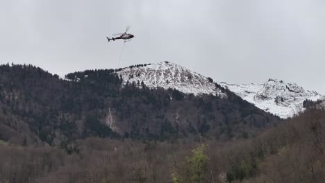 A-helicopter-hovers-above-the-residential-expanse-of-Weesen,-St