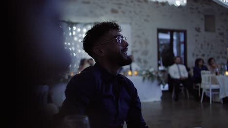 Slow-motion-shot-of-guests-laughing-at-the-speeches-during-the-wedding-ceremony