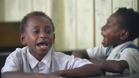 Papua-children-singing-in-gymnasium-classroom-Indonesian-Asian-boys