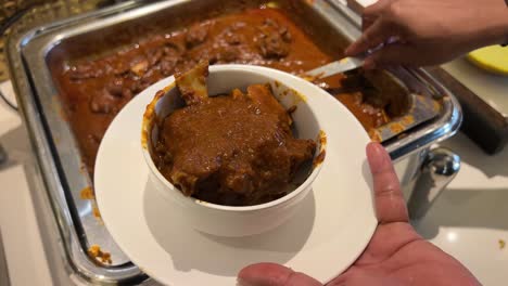 Closeup-view-of-Indian-dish-Mutton-Kosha-served-in-a-white-bowl