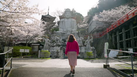 Female-Tourist-In-Tsubosaka-dera-Buddhist-Temple-During-Springtime-In-Takatori,-Japan