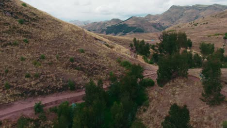 Old-Inca-road-trek-leading-to-Huanacaure,-birthplace-of-Cuzco,-Peru,-dolly-in-aerial