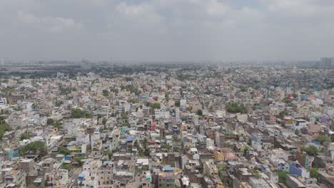 A-breathtaking-aerial-perspective-of-Chennai's-cityscape,-showcasing-the-convergence-of-modernity-and-tradition-amidst-a-cloudy-atmosphere