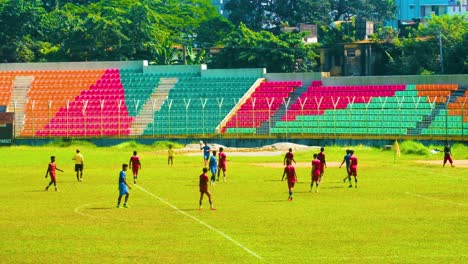 Football-Players-in-the-Junior-Division-Engaging-in-a-Match-in-Sylhet,-Bangladesh---Wide-Shot