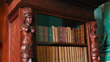 Carved-bookcase-pillars-frame-classic-tomes-in-Trakošćan-Castle's-Library