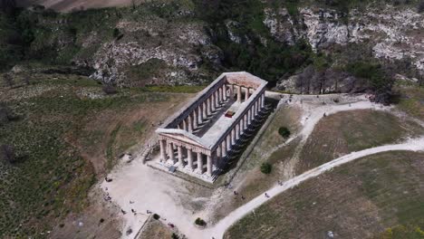 Drone-Descends-to-Reveal-Ancient-Ruins-of-Segesta-in-Sicily,-Italy