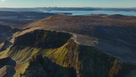 Ancient-landslip-ridge-geography-in-winter-early-morning-light-with-distant-view-of-coastline