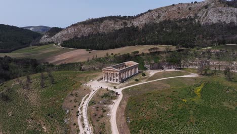 Aerial-Boom-Shot-Above-Temple-of-Segesta,-a-Major-City-of-the-Elymians-in-Sicily
