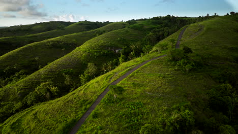 Scooter-ride-through-the-Teletubbies-hills-of-Bali,-breathtaking-experience