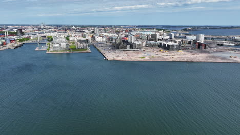 Aerial-view-circling-toward-the-Jatkasaari-island,-summer-in-Helsinki,-Finland