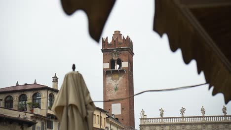 Scenic-exterior-view-of-the-Torre-dei-Lamberti-tourist-attraction-tower-built-in-1172-in-Verona,-Italy